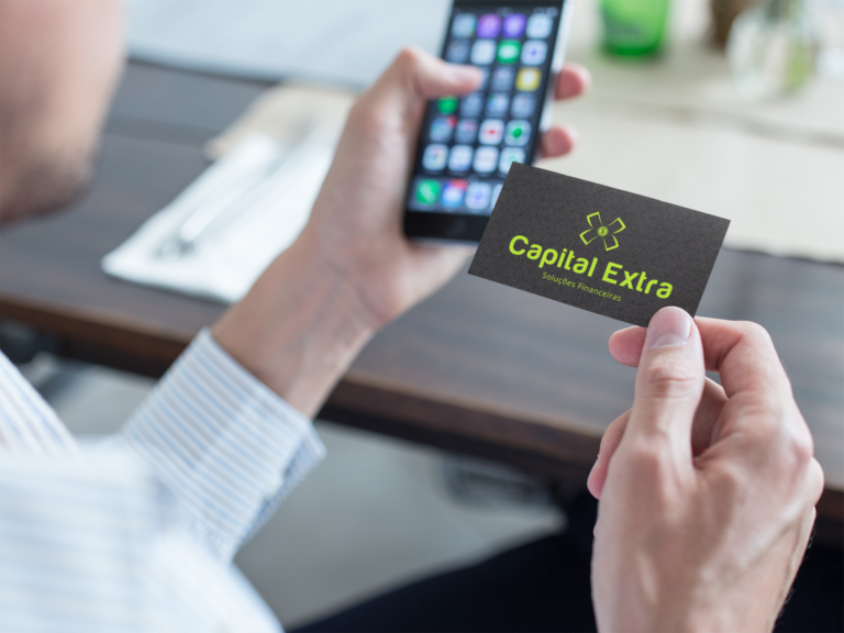 mockup-of-a-business-man-using-a-business-card-to-contact-a-person-with-his-phone-a15032