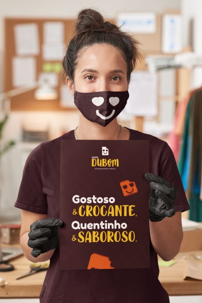 mockup-of-a-woman-wearing-a-face-mask-while-holding-a-poster-45556-r-el2